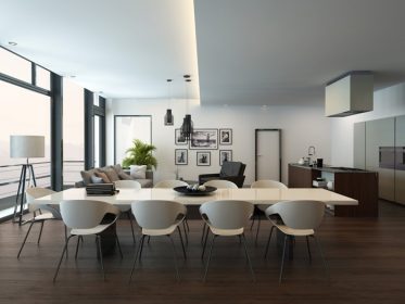 دانلود لوکس مدرن آپارتمان اتاق نشیمن داخلی با کف پارکت، میز ناهار خوری سفید، منطقه سالن و آشپزخانه با یک جزیره آشپزخانه. رندر 3d