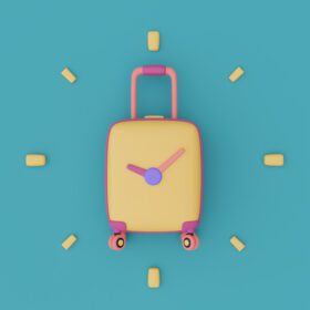 دانلود عکس چمدان زرد با ساعت ساعت برای سفر مفهوم تعطیلات