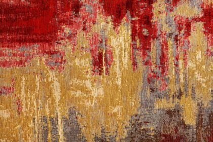 دانلود عکس انتزاعی طرح فرش نساجی قرمز و طلایی به سبک شرقی