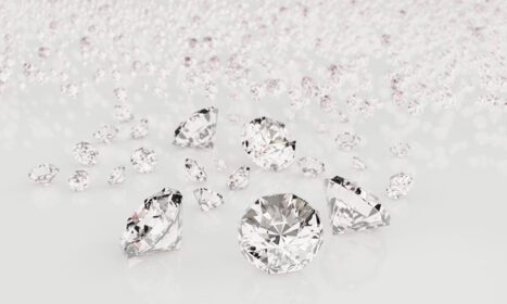 دانلود عکس الماس با اندازه های مختلف در پس زمینه سفید با انعکاس